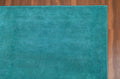 Liso Turquoise solid hand-tufted wool rug, view 1
