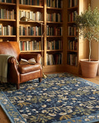 Adline Tulip Floral Wool Rug in a library reading corner