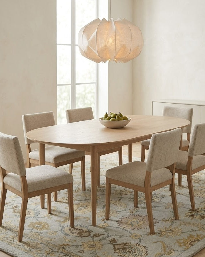 Gabriel Floral Wool Rug in Gray under an oval dining table