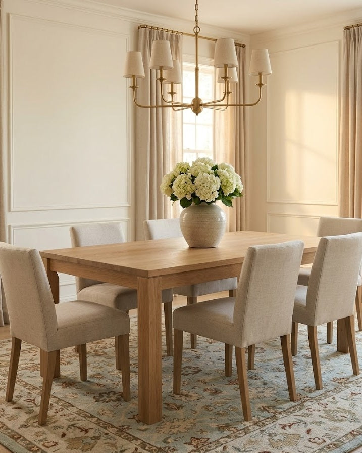 Malicka Persian-style wool rug under a dining table
